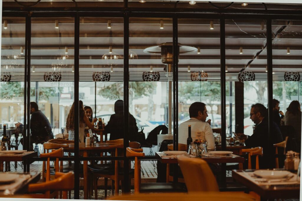 Diners enjoying a meal in a busy restaurant