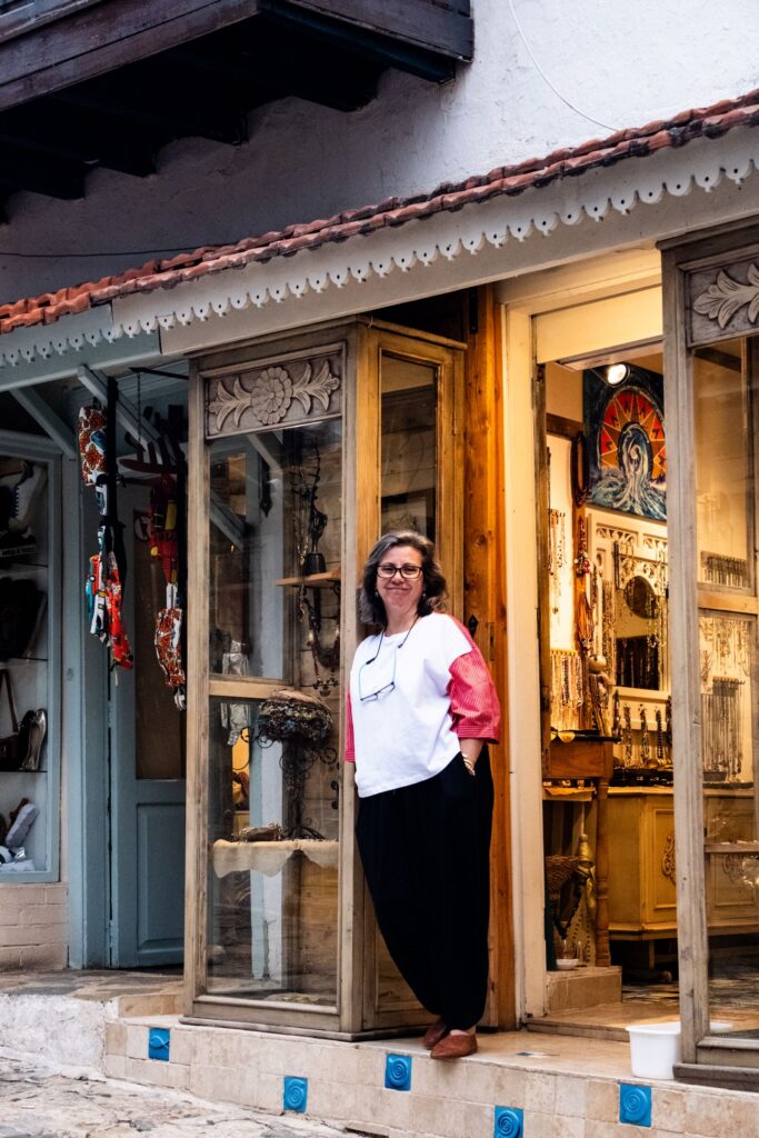 Smiling shop owner outside an artisan store